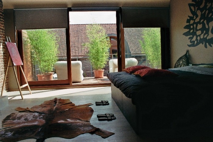 Slaapkamer van Suite Jeff met zicht op het terras
